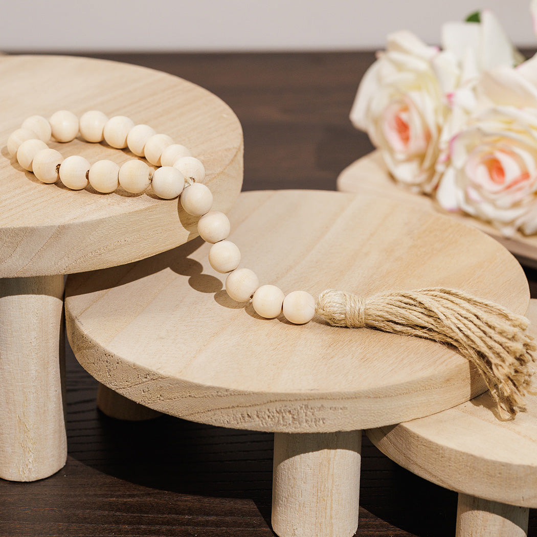 KOART| Sira μικρό διακοσμητικό αντικείμενο με ξύλινες χάντρες τύπου κομπολόι σε μπεζ χρώμα εκ